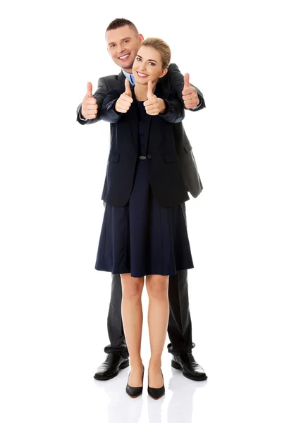 Business couple showing thumbs up — Stock Photo, Image