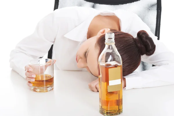 Alone young businesswoman drinking alcohol — Stock Photo, Image