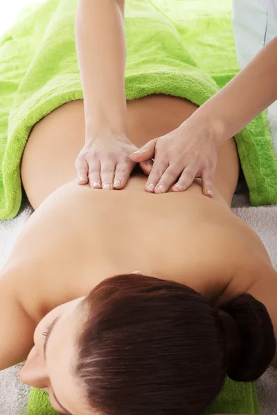 Girl on a stone therapy, hot stone massage — Stock Photo, Image