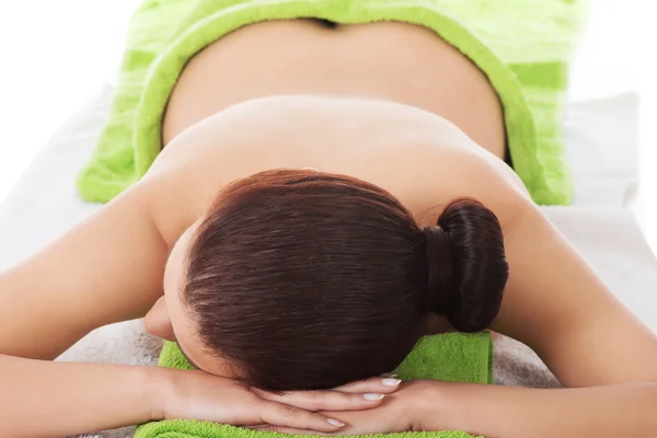 Girl on a stone therapy, hot stone massage — Stock Photo, Image