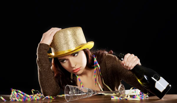 Young drunk woman  with empty champagne bottle — Stock Photo, Image