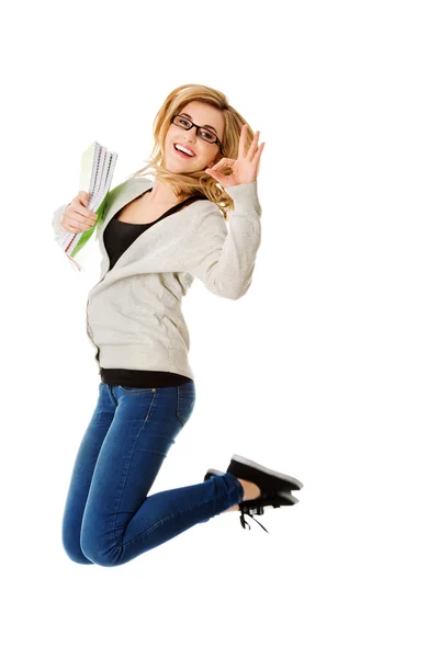 Young casual woman, student jumping. — Stock Photo, Image