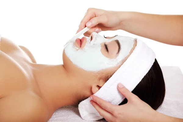 Relaxed woman with a nourishing face mask Royalty Free Stock Images