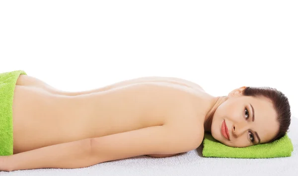 Girl on a stone therapy, hot stone massage — Stock Photo, Image