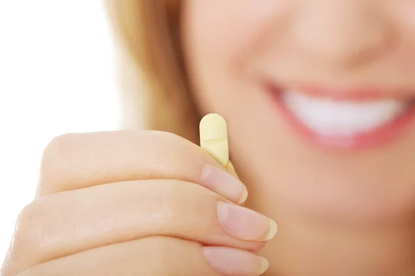 Woman with pill — Stock Photo, Image