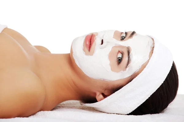 Relaxed woman with a nourishing face mask — Stock Photo, Image