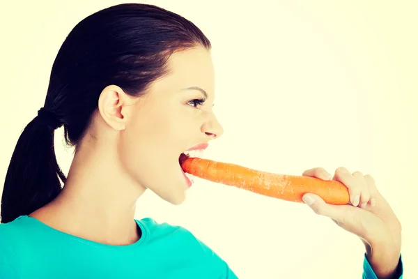 Happy beautiful woman with carrot — Stock Photo, Image