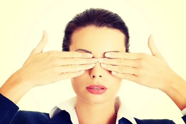 Attractive businesswoman covering her eyes — Stock Photo, Image