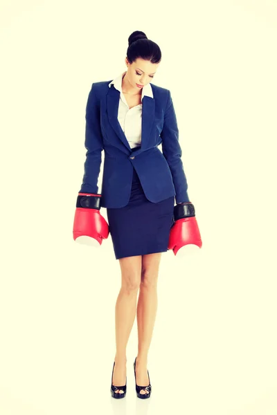 Defeated businesswoman in boxing gloves — Stock Photo, Image