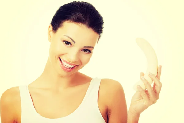 Attractive fit woman eating banana — Stock Photo, Image