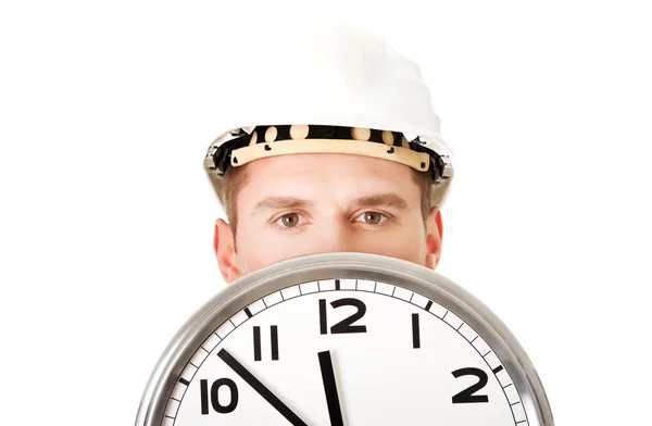 Businessman wearing helmet with clock — Stock Photo, Image