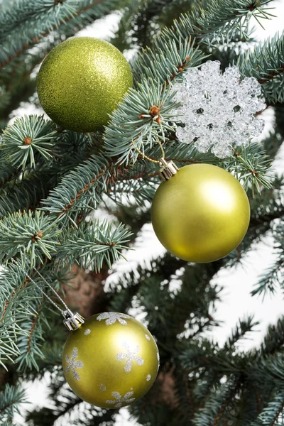 Three christmas balls on a tree. — Stock Photo, Image