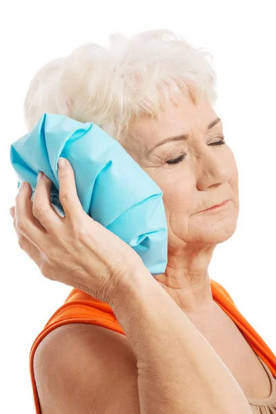 An old elegant lady is having a headache — Stock Photo, Image