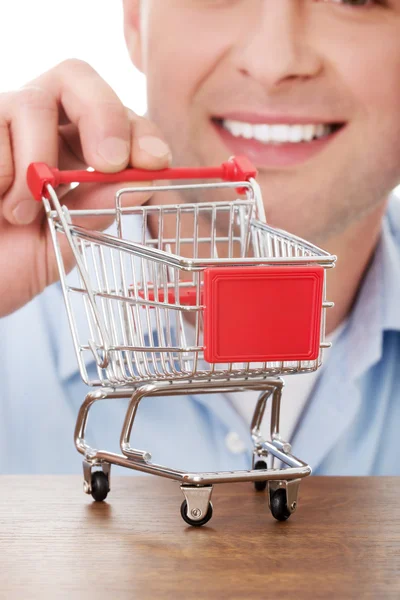 Man with a small shopping basket. — Stock Photo, Image