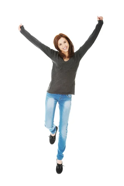 Young casual woman, student jumping. — Stock Photo, Image