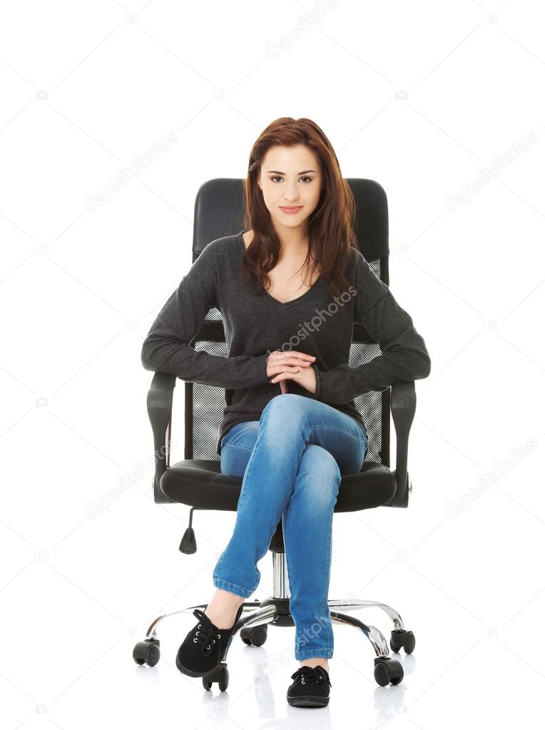 Young happy student woman sitting on a wheel chair