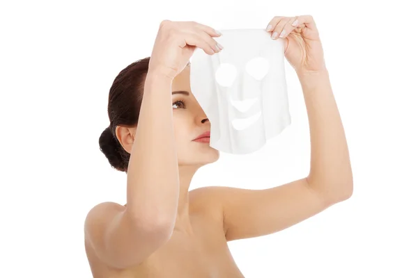 Beautiful woman with collagen mask. — Stock Photo, Image