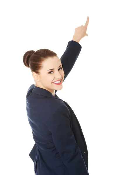 Business woman pointing on copy space. — Stock Photo, Image