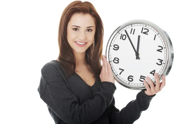 Happy woman holding office clock — Stock Photo, Image