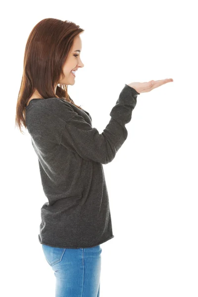 Woman showing something or copyspase — Stock Photo, Image