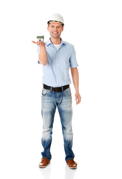 A forewoman holding a model house — Stock Photo, Image