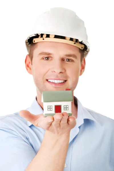 A forewoman holding a model house — Stock Photo, Image