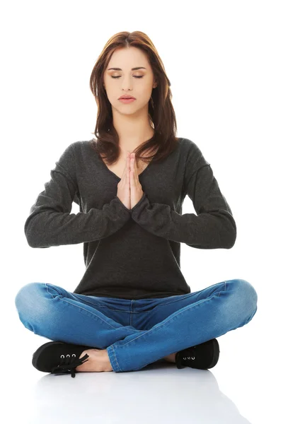 Girl meditating in lotus pose — Stock Photo, Image