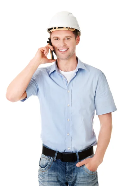 Contractor talks on his cell phone. — Stock Photo, Image