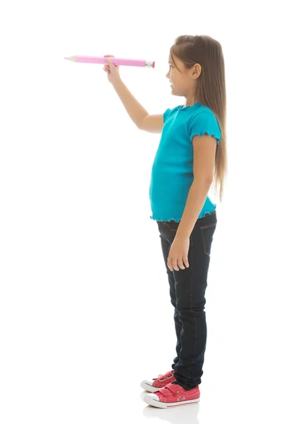 Niña con un lápiz — Foto de Stock