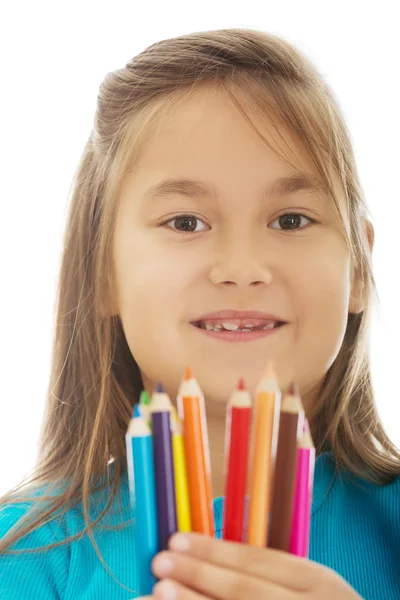 Niña sosteniendo crayones — Foto de Stock