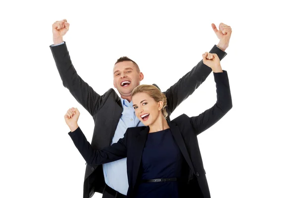 Victorious business couple with hands up — Stock Photo, Image