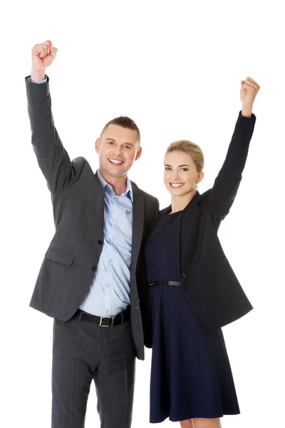 Victorious business couple with hands up — Stock Photo, Image