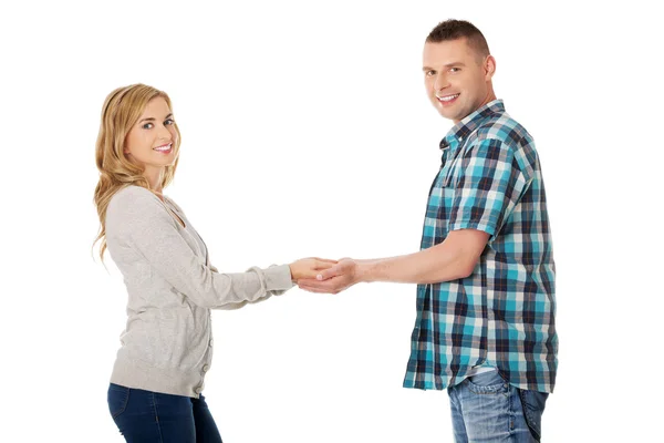 Feliz pareja cogida de la mano — Foto de Stock