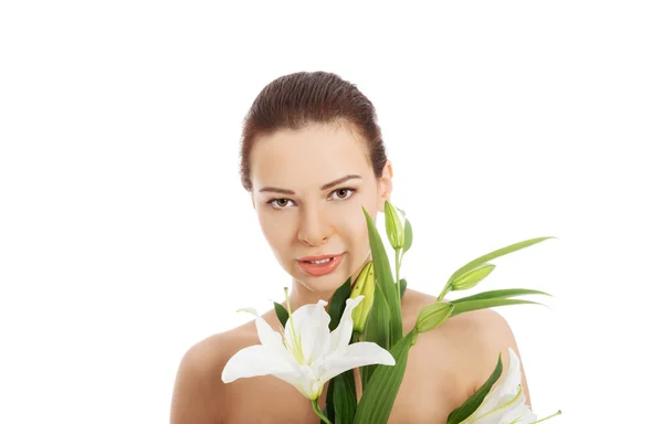 Vrouw met een lily bloem — Stockfoto
