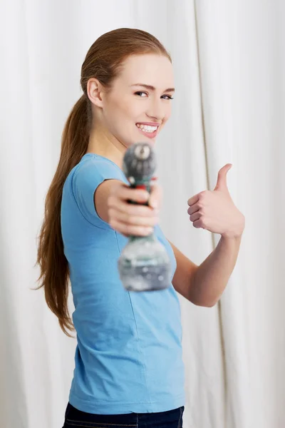 Woman with a power drill — Stock Photo, Image