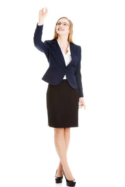 Businesswoman catching something — Stock Photo, Image