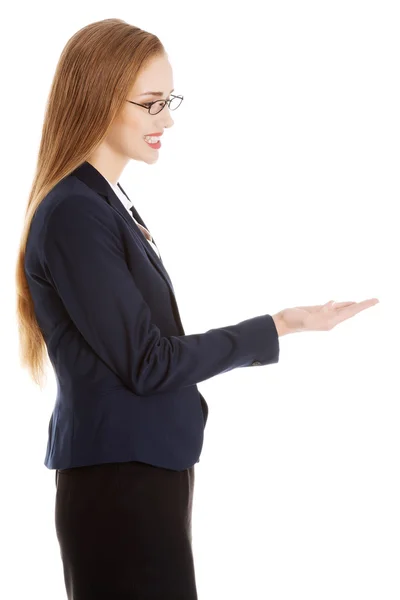 Businesswoman presenting something — Stock Photo, Image