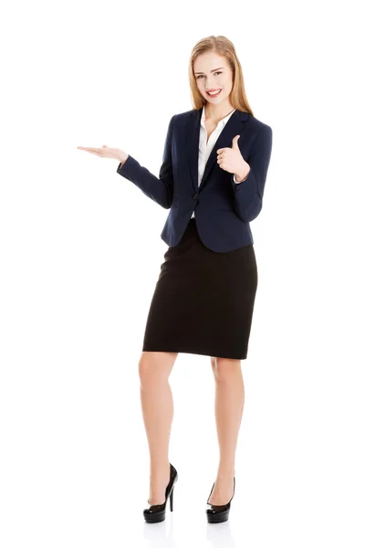 Businesswoman inviting to an office — Stock Photo, Image