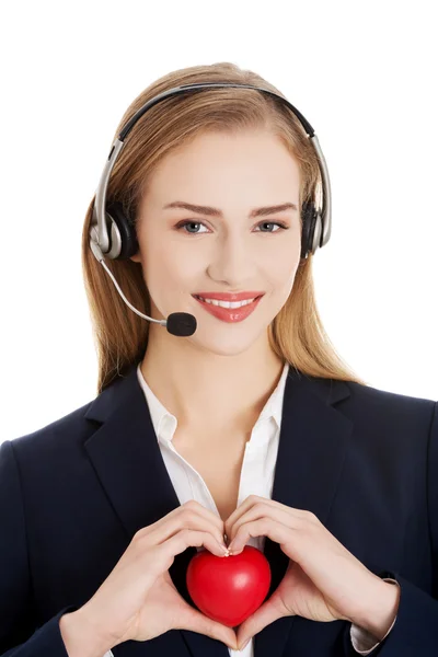 Call center woman holding heart — Stock Photo, Image