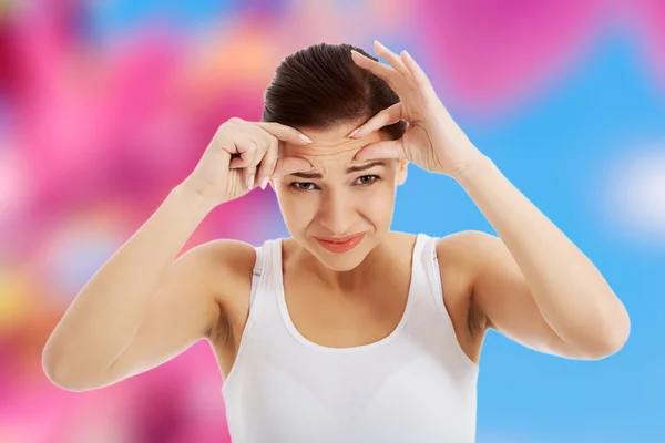 Woman removing vesicle — Stock Photo, Image