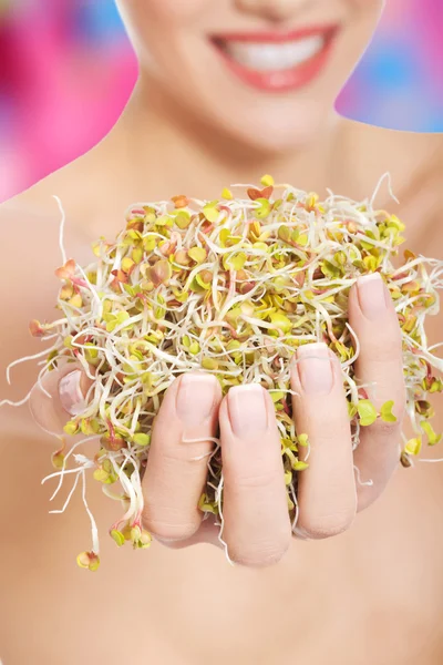 Caucasian woman holding cress — Stock Photo, Image