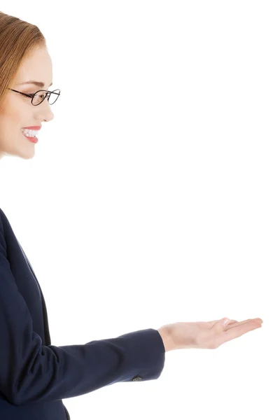 Businesswoman presenting something — Stock Photo, Image