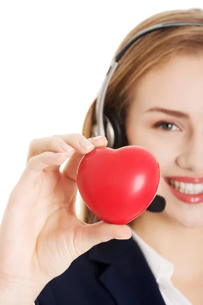 Call center woman holding heart — Stock Photo, Image