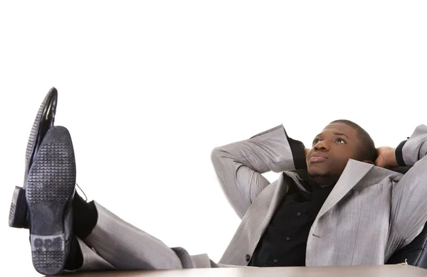 Black man relaxing in the office — Stock Photo, Image
