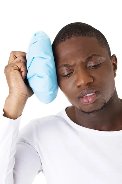 Muscular black man with headache — Stock Photo, Image