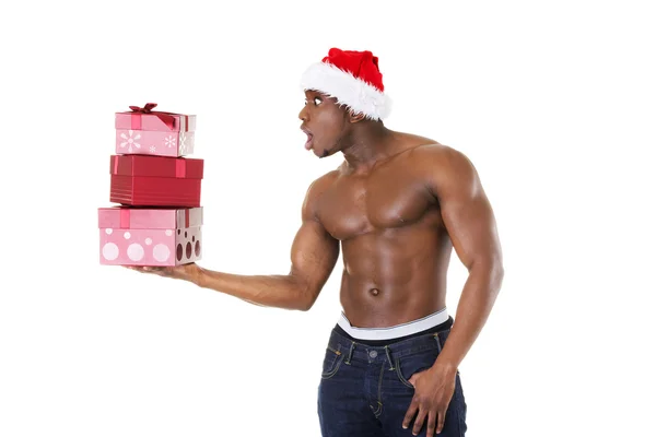 Black man wearing holding christmas gifts — Stock Photo, Image