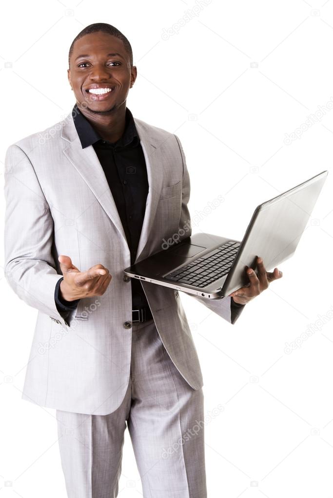 Black man standing with the laptop