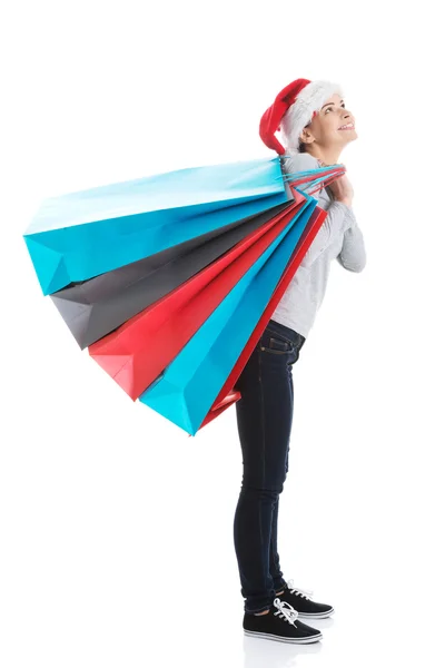 Woman carrying sack full of presents — Stock Photo, Image