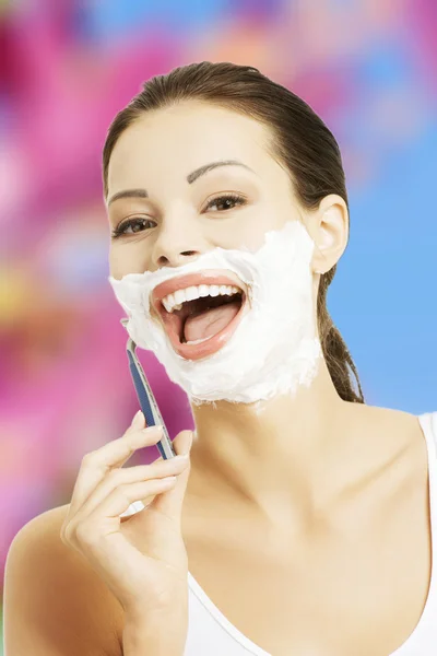 Woman shaving face — Stock Photo, Image