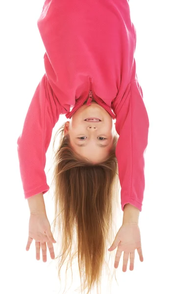 Girl hanging upside down — Stock Photo, Image